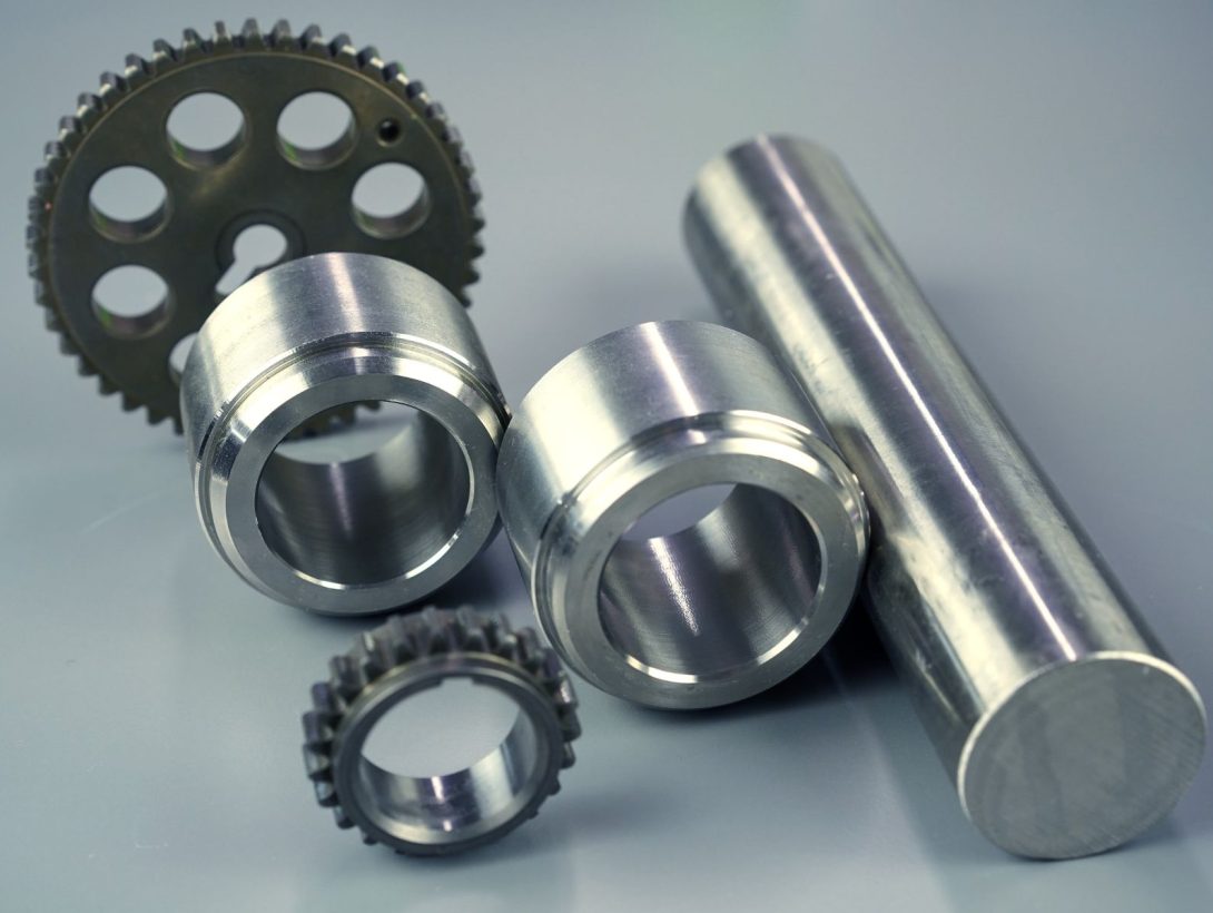 Precision machined metal components including gears, bushings and shaft