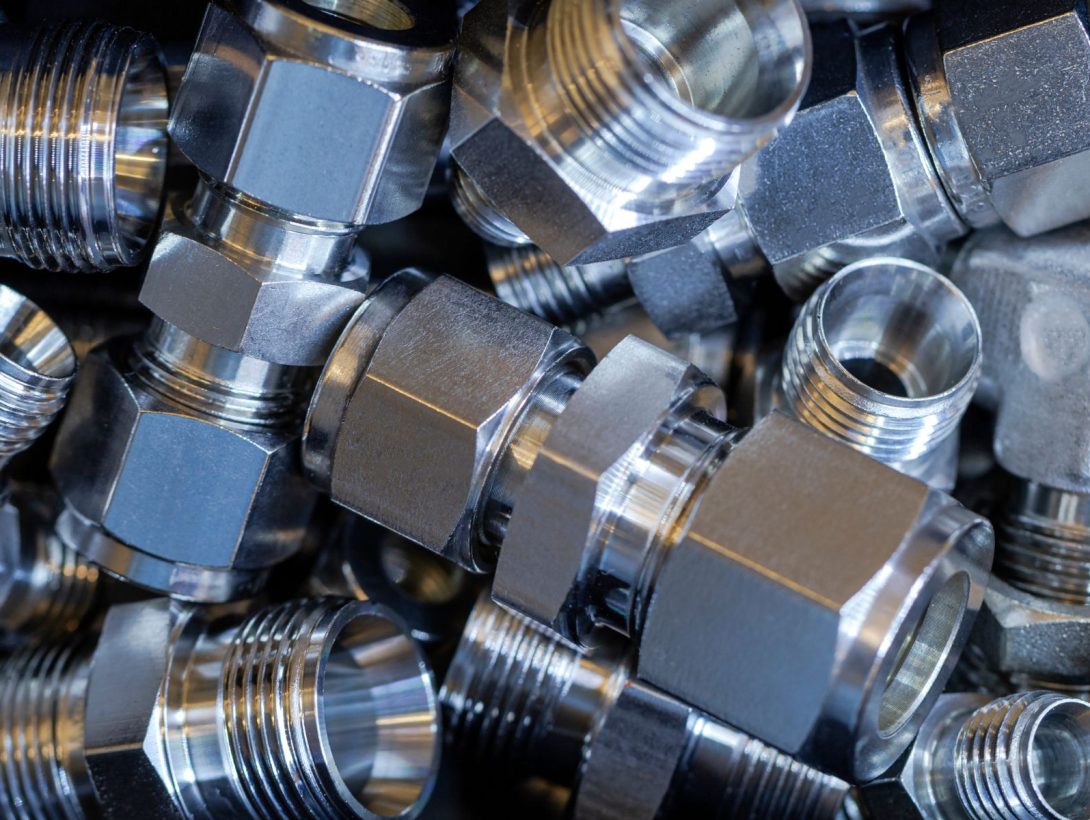 Precision machined stainless steel fittings with threaded connections
