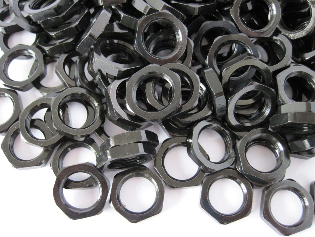 Zinc iron plated hexagonal nuts with dark black finish by Plating Tech